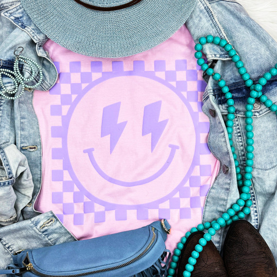 Checkered Happy Face Lavender PUFF - Screen Print Transfer, lavender-colored fabric with a smiling face design featuring lightning bolt eyes and checkered pattern background.