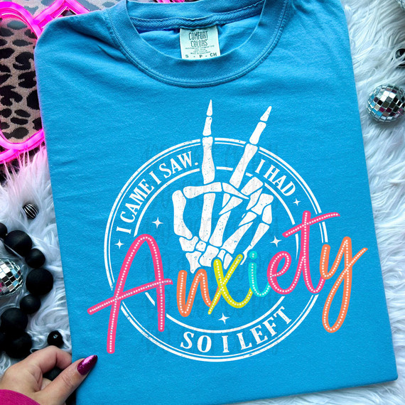 Product I Came I Saw I Had Anxiety So I Left DTF Heat Transfer, blue T-shirt with colorful text and skeleton hand design.