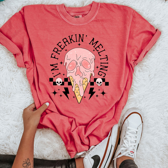 I'm Freakin Melting DTF Heat Transfer, pink graphic t-shirt featuring melting ice cream skull design with text and decorative elements.