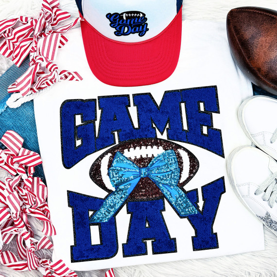 Royal Chenille Football Game Day with Sequin Bow (BLACK BACKING) Patch, close-up of a white shirt featuring a blue football with a blue sequin bow, surrounded by game day themed accessories.