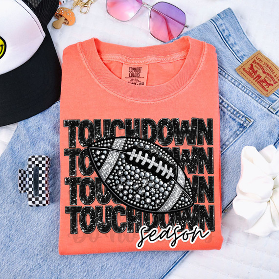 Touchdown Season Faux Rhinestone DTF Heat Transfer, a sparkling football design on a coral T-shirt with black and white text in the background.
