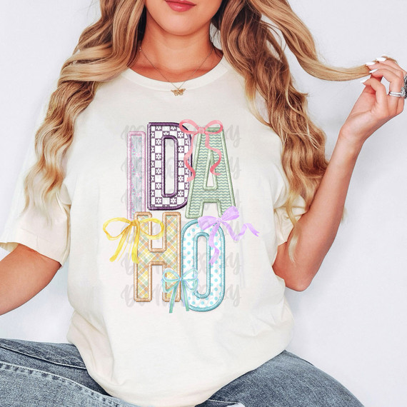 Idaho Coquette Faux Embroidery DTF Heat Transfer, colorful embroidered design with bows on a white T-shirt, fashionable women's clothing.