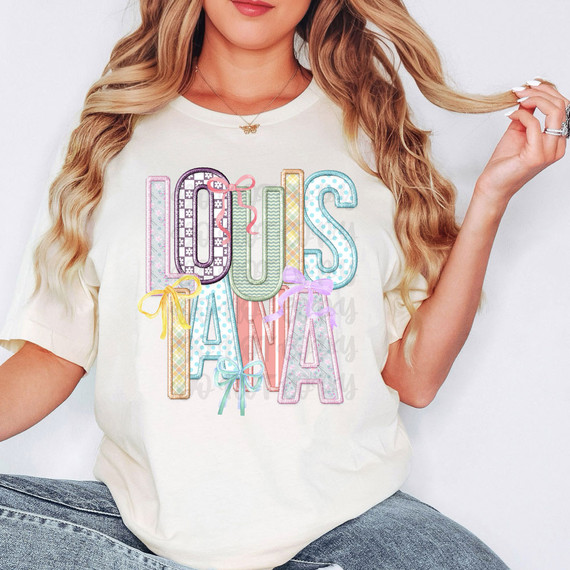 Louisiana Coquette Faux Embroidery DTF Heat Transfer, colorful embroidered letter design on a white t-shirt for fashion embellishment.