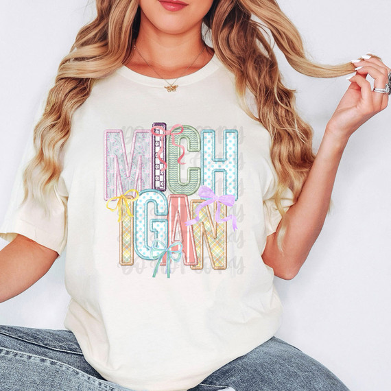 Michigan Coquette Faux Embroidery DTF Heat Transfer, colorful pastel embroidered text design on a white t-shirt.