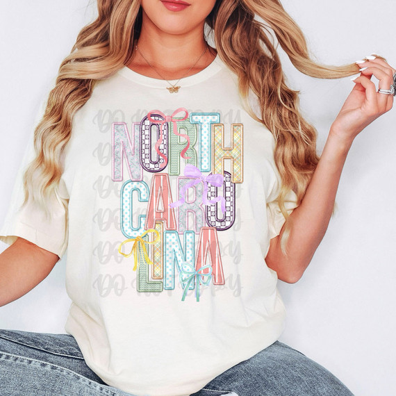 North Carolina Coquette Faux Embroidery DTF Heat Transfer, colorful embroidered letters on a woman's t-shirt.