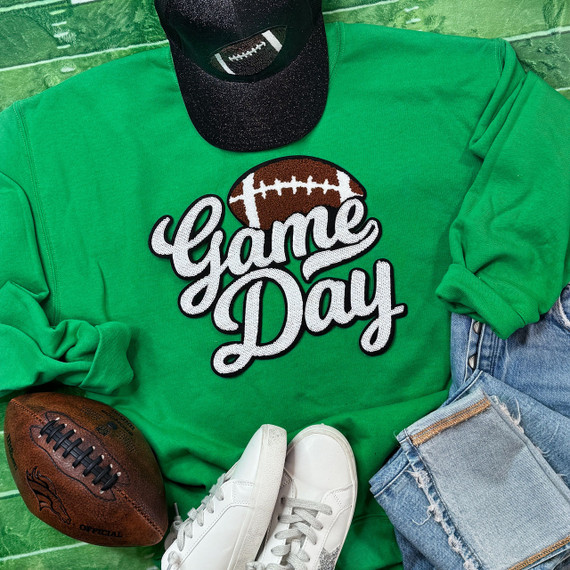 White Sequin Football Game Day Patch, featuring a football design with white sequins on a green sweatshirt.