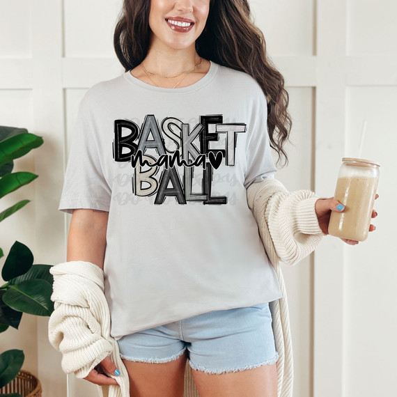 Basketball Mama Monochrome DTF Heat Transfer, a woman wearing a white t-shirt with basketball-themed text design.
