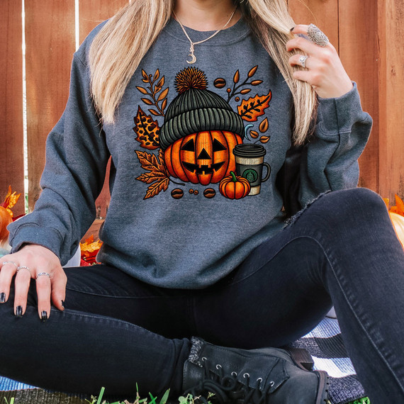 Fall Pumpkin Faux Embroidery DTF Heat Transfer, Halloween-themed pumpkin wearing a knit hat with autumn leaves and coffee cup surrounding it.