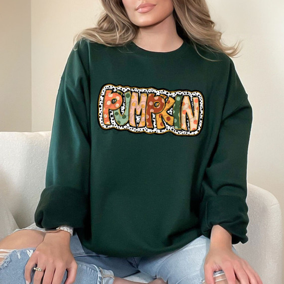 Pumpkin Fall Polka Dots DTF Heat Transfer, colorful pumpkin-themed polka dots design on a dark green sweatshirt.