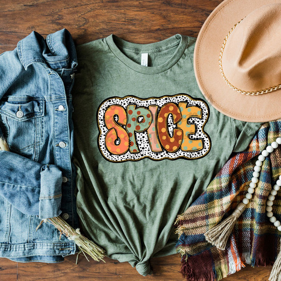 Spice Fall Polka Dots DTF Heat Transfer, colorful polka dot design with the word 'SPICE' on a green T-shirt, surrounded by fashion accessories like a denim jacket, beige hat, plaid scarf, and pearl necklace.