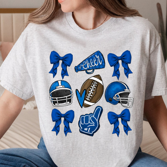 Blue Cheer Bows DTF Heat Transfer, illustrated design featuring blue bows, football helmets, a football, and cheerleading symbols on a gray T-shirt.