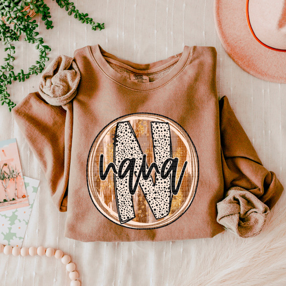 Nana Fall Brushstrokes DTF Heat Transfer, personalized sweatshirt with a circular design featuring a large letter 'W' with brushstroke texture and the word 'hello' written across it.