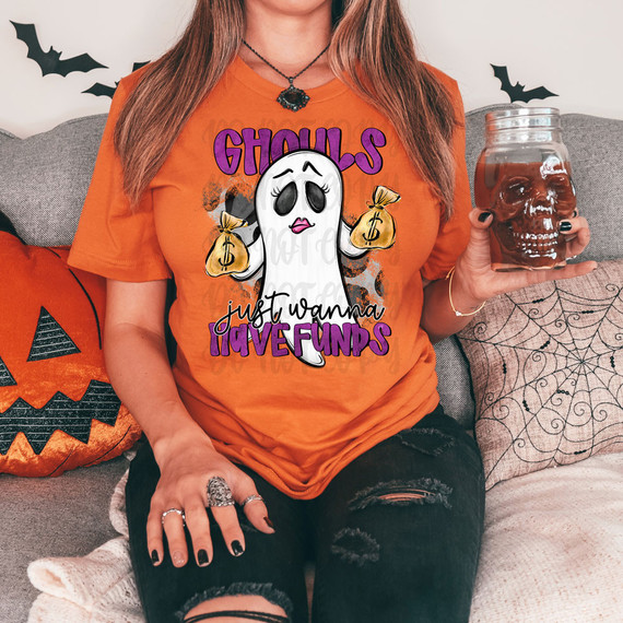 Ghouls Just Wanna Have Funds DTF Heat Transfer T-shirt featuring a cartoon ghost holding money bags with the phrase 'just wanna have funds' in purple, black, and white lettering.