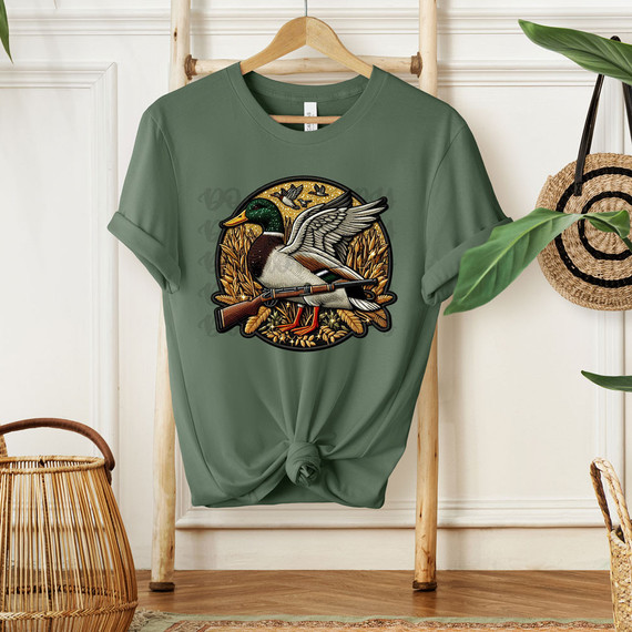 Duck Hunt Faux Patch DTF Heat Transfer, embroidered duck graphic on a green T-shirt.