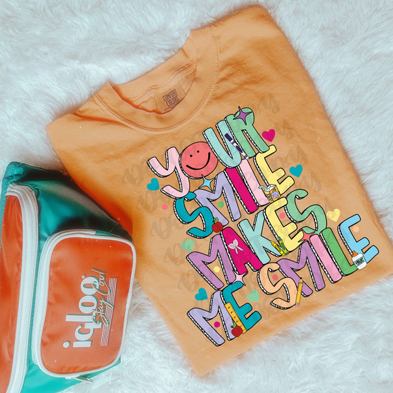 Your Smile Makes Me Smile Dots DTF Heat Transfer, colorful and cheerful design with smiling face and vibrant colors on a peach-colored T-shirt.