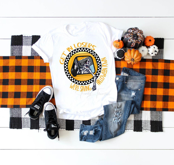 Get in Losers we're saving Halloweentown Benny's Taxi Sublimation Transfer - Halloween-themed t-shirt design with a skeleton in a taxi, pumpkins, and Halloween decorations.