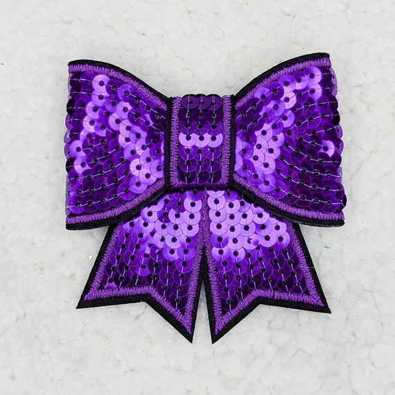 PURPLE Sequin Bow HAT/POCKET Patch, a decorative patch featuring a large purple bow adorned with shiny sequins on a light background.