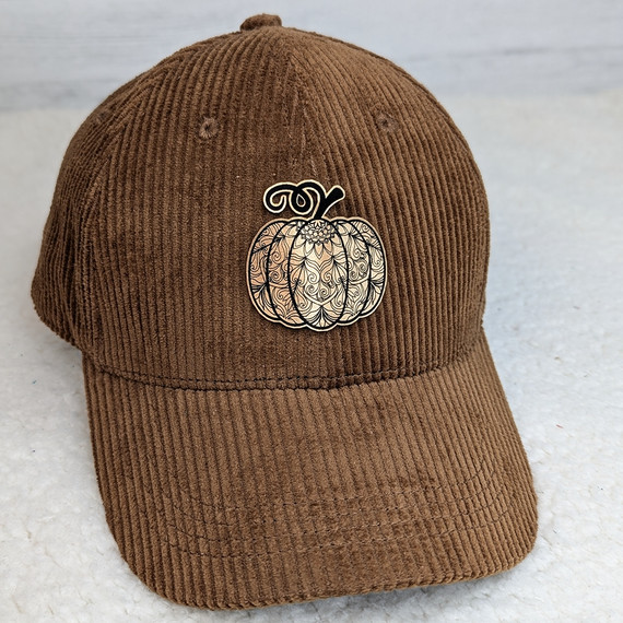Ornate Pumpkin FAUX Leather Patch, decorative pumpkin design with intricate detailing on a brown corduroy baseball cap.