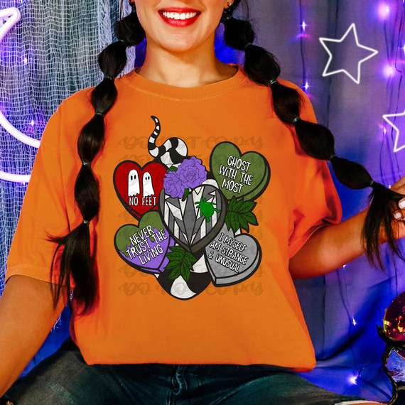 Beetle Hearts DTF Heat Transfer, graphic design with various horror-themed hearts and spooky messages on an orange T-shirt