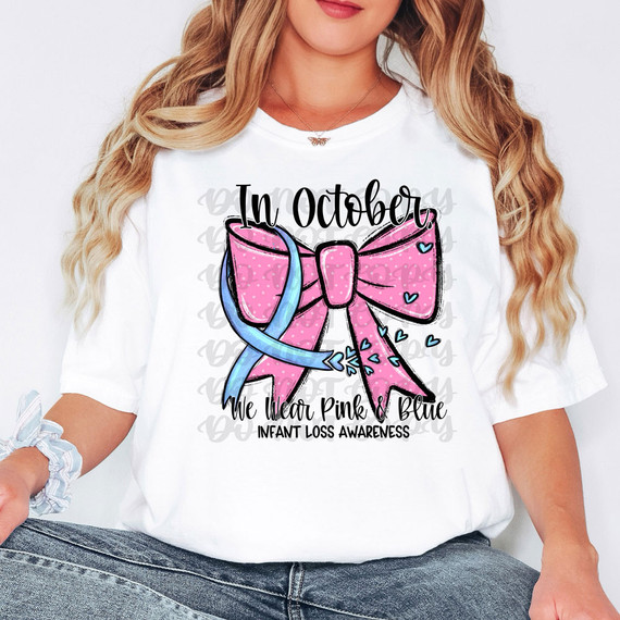 In October, We Wear Pink & Blue Infant Loss Awareness DTF Heat Transfer, product with pink bow and blue ribbon design on a white t-shirt.