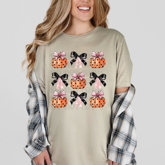 Polka Dot Pumpkin Coquette DTF Heat Transfer, a design featuring pumpkins with pink and black bows on a beige t-shirt.
