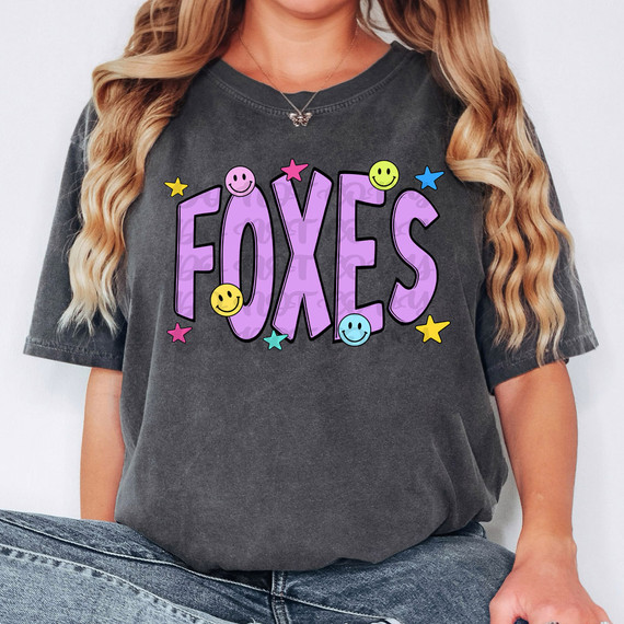 Foxes Happy Face DTF Heat Transfer, colorful printed design with smiling faces, stars, and bold text on black t-shirt.