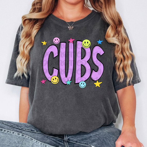 Cubs Happy Face DTF Heat Transfer, colorful purple lettering with smiley faces and stars, applied on a dark gray t-shirt