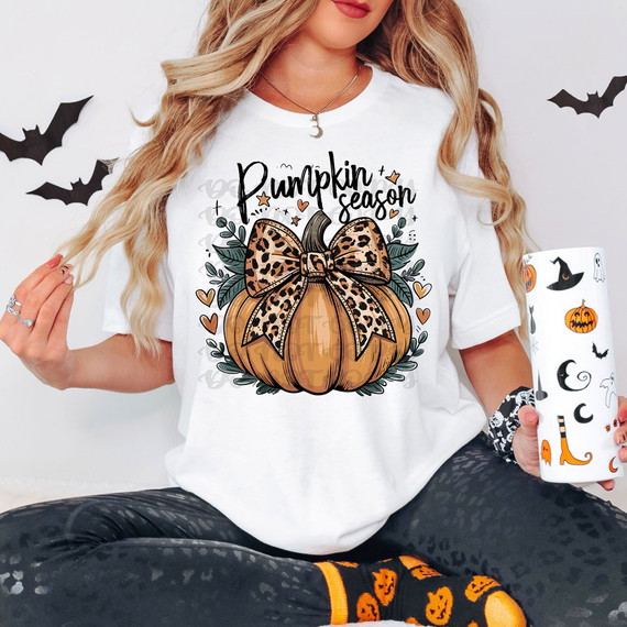 Pumpkin Season Leopard DTF Heat Transfer, festive Halloween-themed design of a pumpkin with a leopard print bow, surrounded by leaves and hearts.