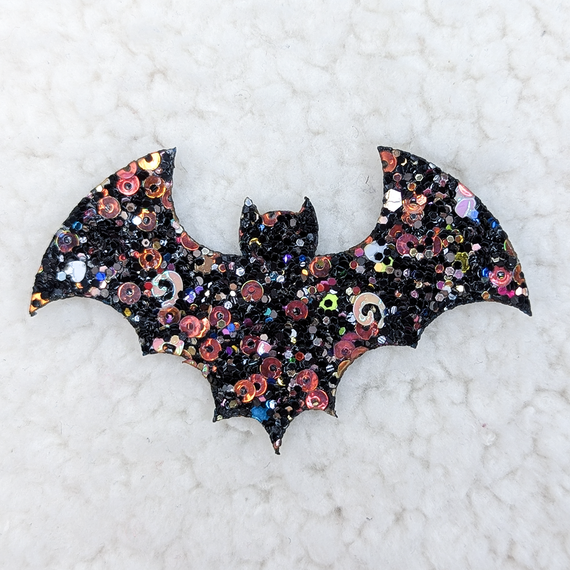 Glitter & Sequin BAT HAT/POCKET Patch, a decorative patch featuring a bat shape embellished with colorful sequins and glitter for fashion or craft use.