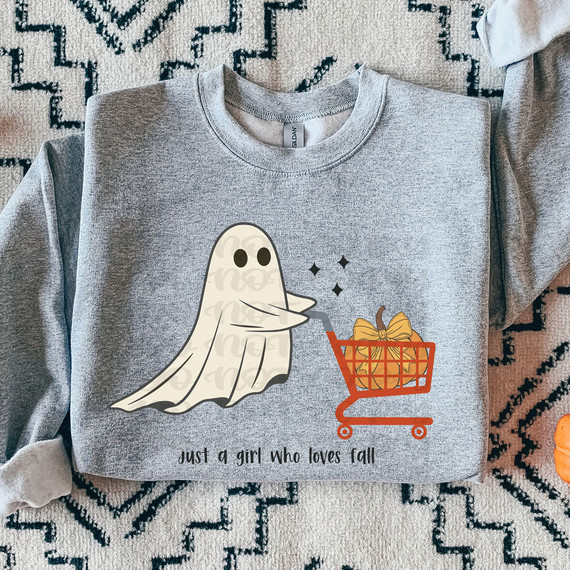Just A Girl Who Loves Fall DTF Heat Transfer T-shirt, grey shirt with ghost holding a shopping cart with a gift, and the text 'just a girl who loves fall'.