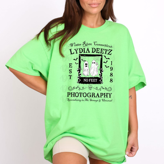Lydia Deetz Photography DTF Heat Transfer, neon green T-shirt with Halloween-inspired graphic design featuring ghost characters and text.
