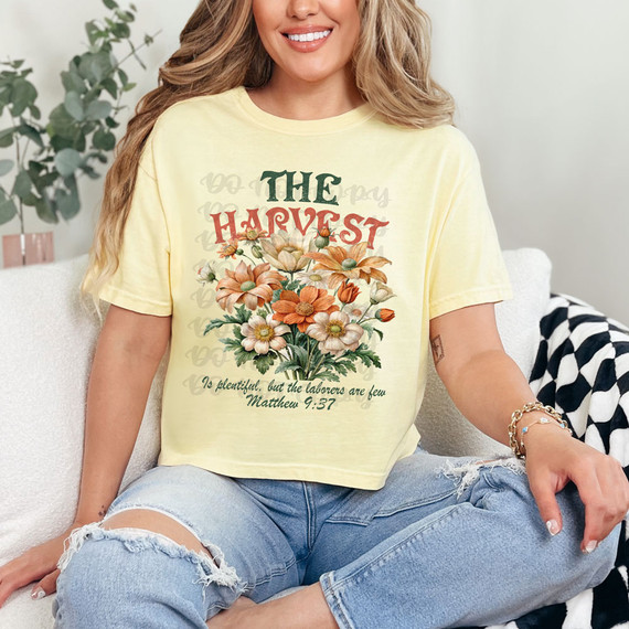 The Harvest Is Plentiful DTF Heat Transfer, floral design with text and Bible verse on a women's yellow T-shirt.