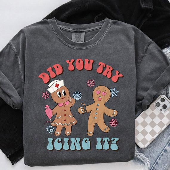 Did You Try Icing It? DTF Heat Transfer, graphic design printed on a grey t-shirt featuring gingerbread characters in a winter theme.