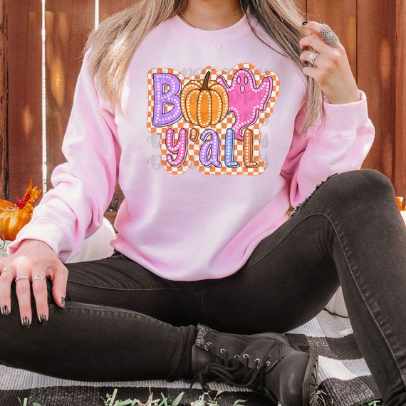 Boo Y'All Retro DTF Heat Transfer, colorful Halloween-themed pumpkin, ghost, and text design on a pink sweatshirt.