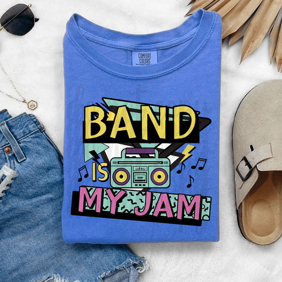 Band Is My Jam DTF Heat Transfer, colorful graphic design with a boombox, musical notes, and vibrant text on a blue t-shirt.