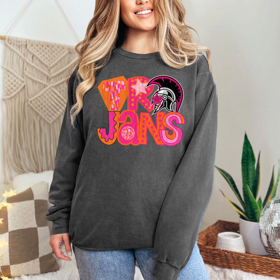 Trojans Pink/Orange Block DTF Heat Transfer, vibrant pink and orange design of the Trojans logo with a helmeted Trojan warrior, on a woman wearing a dark grey sweatshirt.