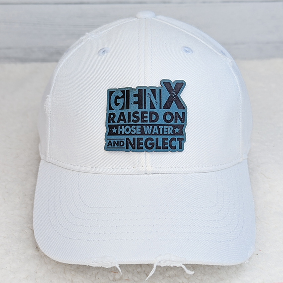 Gen X FAUX Leather Patch, a white baseball cap with a colorful embroidered patch featuring the Gen X logo and slogan.
