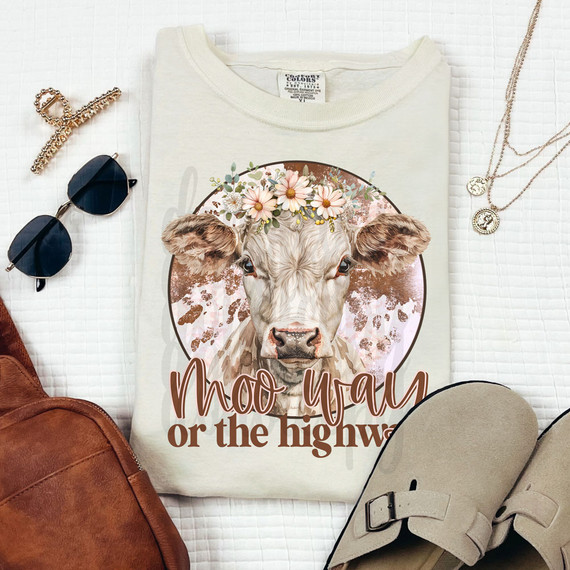 Moo Way or the Highway DTF Heat Transfer, graphic of a cow with floral crown and text on a t-shirt, fashion accessories, sunglasses, and jewelry.
