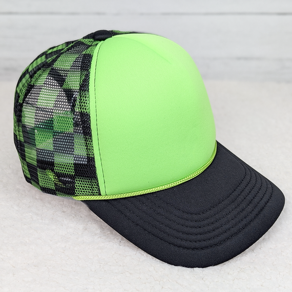 Neon Green & Black Checkered Foam Trucker Hat, a stylish cap with a neon green front panel, a black checkered mesh side and back panels, and a black bill.