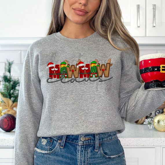 Mawmaw Claus Faux Embroidery DTF Heat Transfer, Christmas-themed embroidered design on a grey sweatshirt featuring festive holiday characters and lettering.