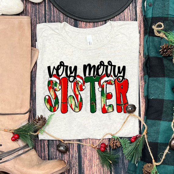 Very Merry Sister DTF Heat Transfer, Christmas-themed T-shirt with colorful holiday design on a gray shirt.
