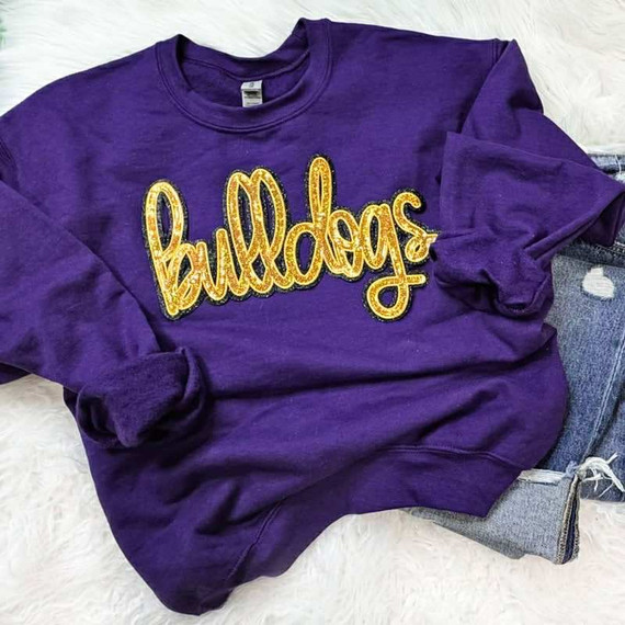 Bulldogs Gold Sequin Patch, purple sweatshirt with gold sequin embroidered 'Bulldogs' lettering.