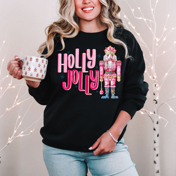 Holly Jolly Nutcracker DTF Heat Transfer, colorful nutcracker design and text on a black sweatshirt.