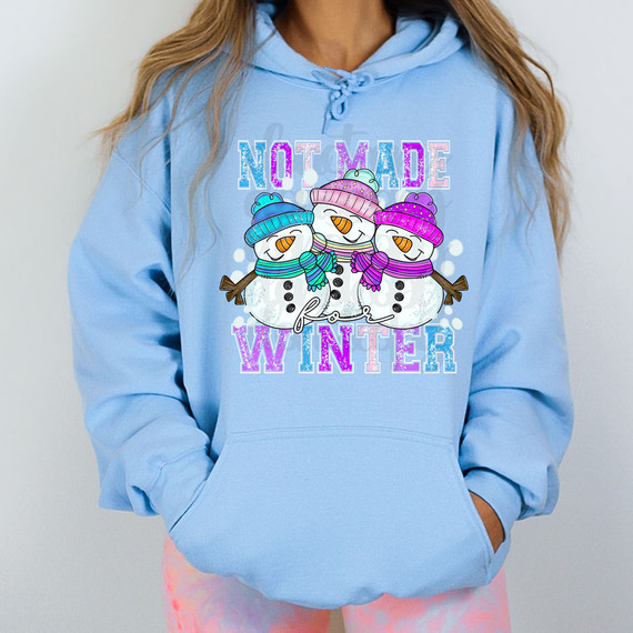 Not Made For Winter Snowman DTF Heat Transfer, colorful snowmen wearing winter hats and scarves on a blue hoodie.