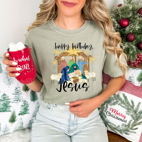 Happy Birthday, Jesus DTF Heat Transfer, Christmas-themed Jesus nativity scene with stars, Mary, Joseph, baby Jesus, shepherds, and sheep on a decorative shirt.
