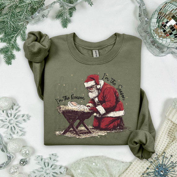 I'm The Reason I'm The Season DTF Heat Transfer, Christmas-themed t-shirt with Santa Claus and nativity scene design.