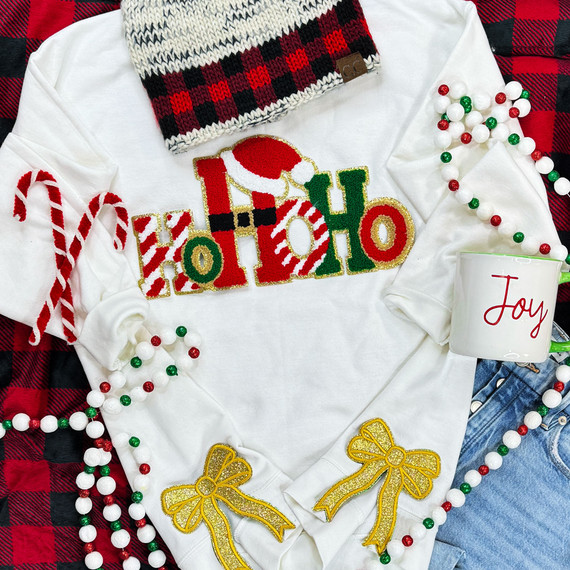 Gold Glitter Bow Sides Sequin Patch SET OF 2, festive Christmas decorations on a white sweatshirt with Christmas-themed embellishments.