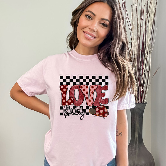 Love Bug Polka Dots DTF Heat Transfer, pink T-shirt with a love bug and polka dot design featuring the word "LOVE" and a ladybug graphic.