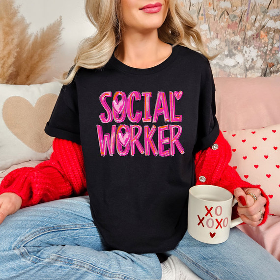 Painted Social Worker DTF Heat Transfer, colorful pink and purple text design on a black t-shirt reading 'Social Worker' with heart accents.