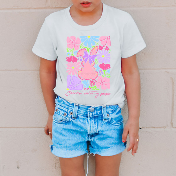 Chillin' With My Peeps Floral DTF Heat Transfer, colorful floral Easter bunny design on a white T-shirt worn by a young girl.